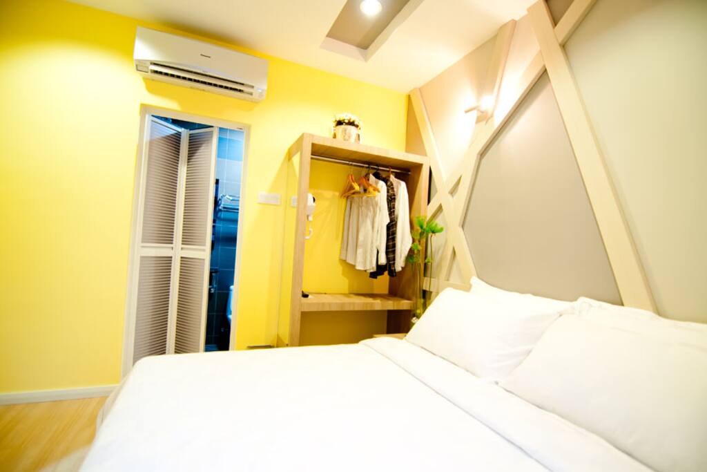 Private toilet with clothes rack