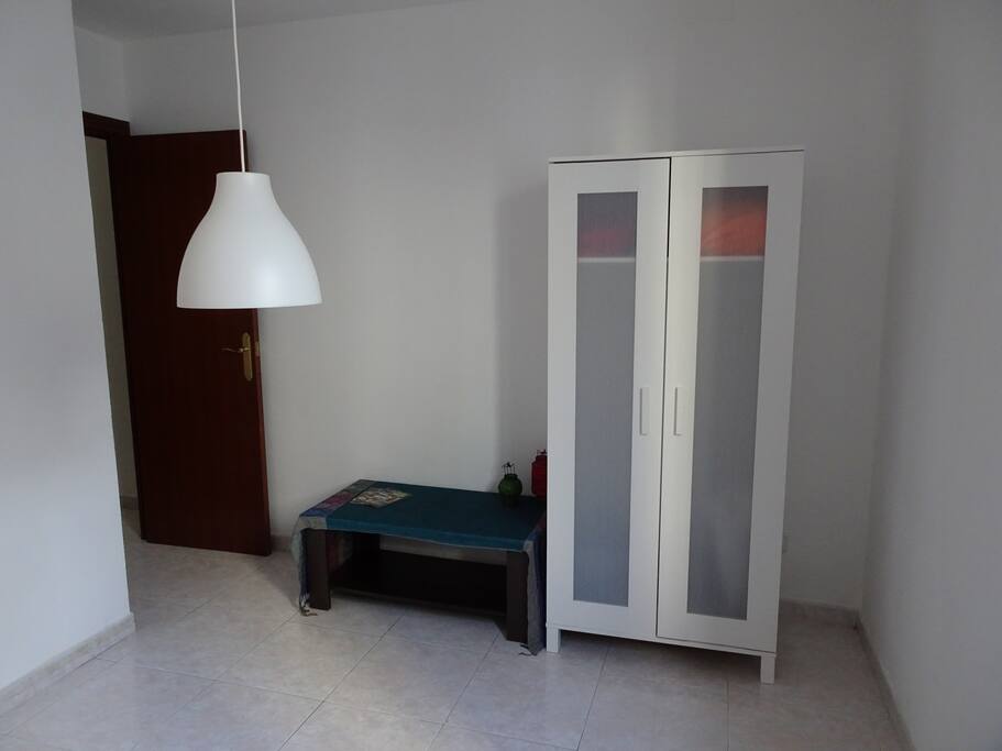 Available closet with hangers.
Table with maps of the city.
