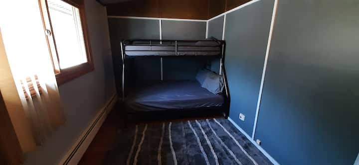 Twin bed on top, full size bed on bottom.