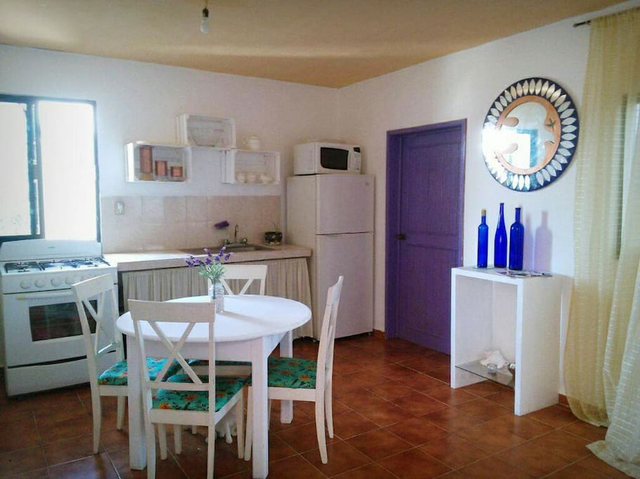 Living Area with Gas Stove and Basic Kitchen Utensils