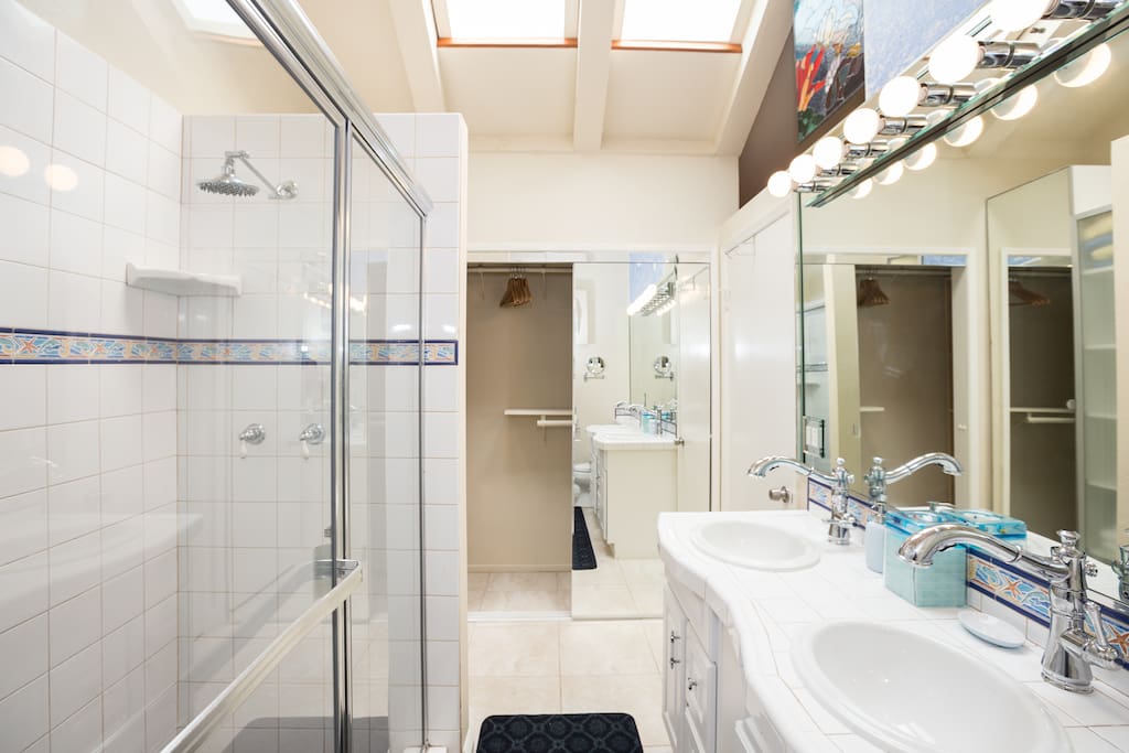 Master Bath with twin basins and showers, Google Dolphin House Huntington Beach for video tour