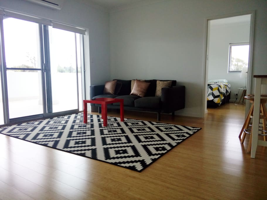 Ample living area with access to 90m2 balcony