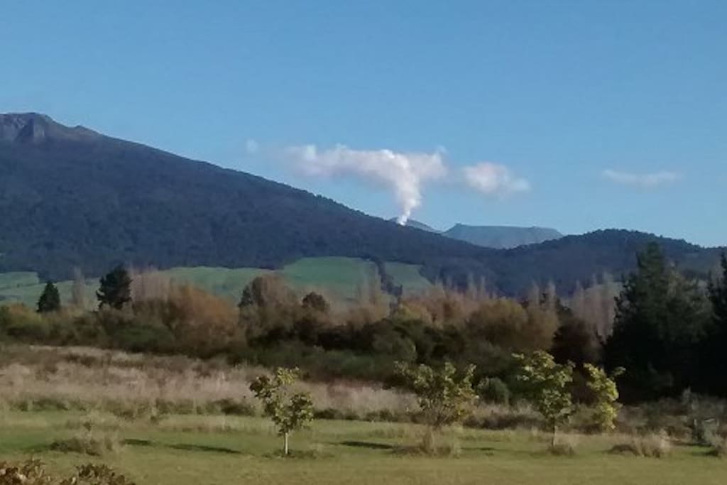 The view from your bedroom with a smoking volcano to thrill you.