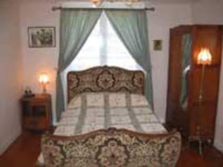 Bedroom with double bed and ensuite bathroom