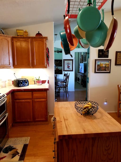 Fun kitchen with double oven gas range, dishwasher, table for two.