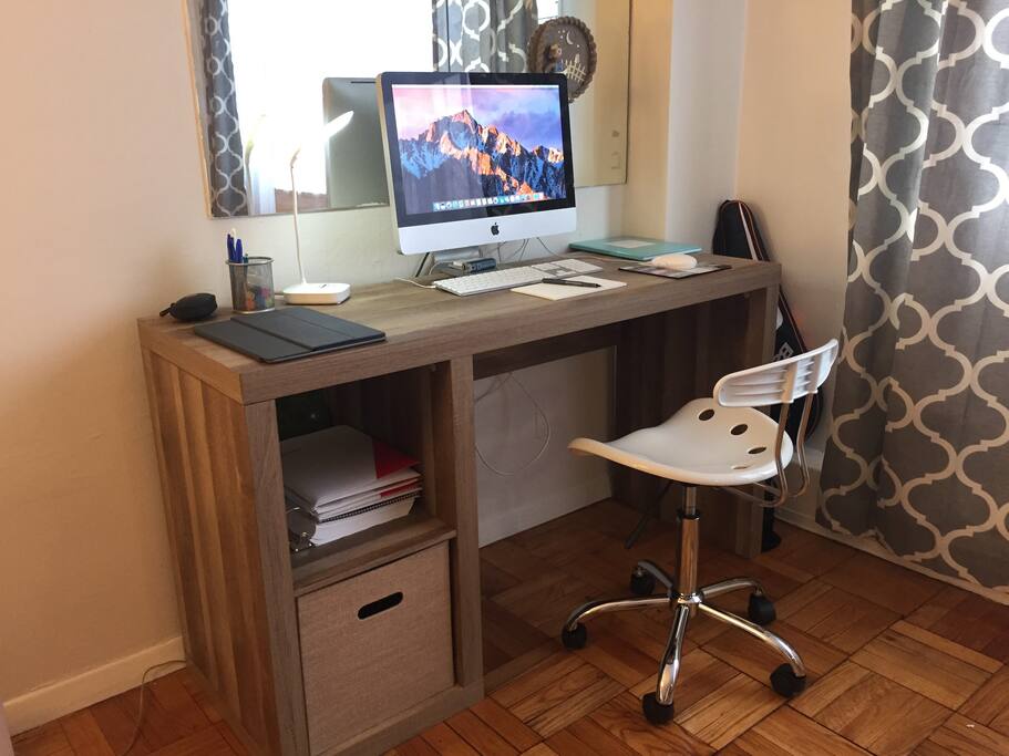 Office area: 21" iMac and weathered oak desk, available for guests use