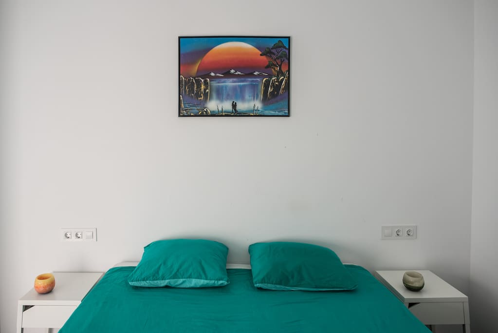 Master bedroom with 2-person bed (2m x 1,6m) with high quality mattress and side tables. Built-in closets and luxury lighting. Direct terrace access + seaview