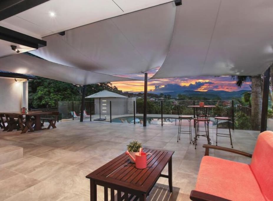 Outdoor sitting, TV, bar fridge area