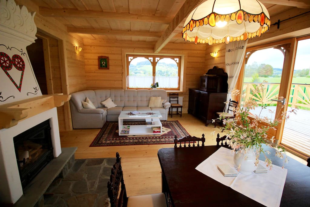 The main living room with dining area, with space for 12 people (table can open bigger) with cozy fireplace