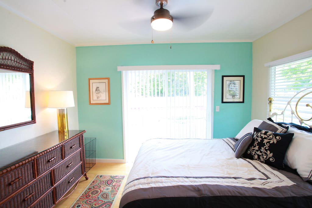 Bedroom with new queen bed facing hot tub on back deck and cold A/C