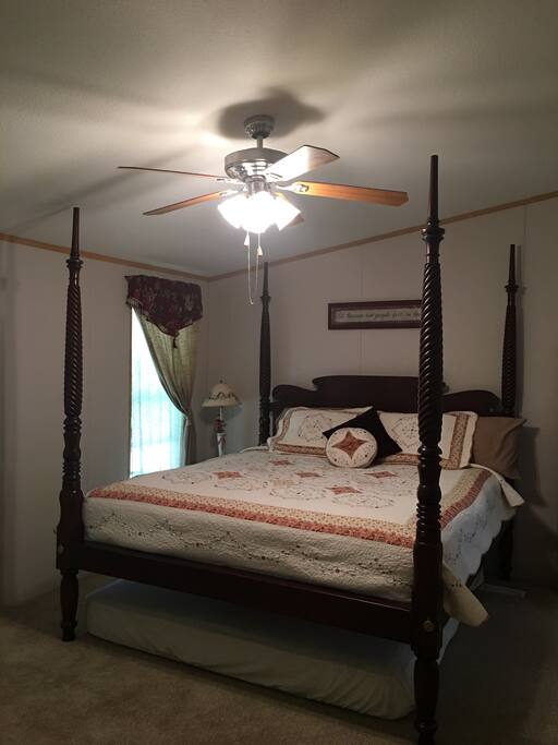 The master bedroom has a king sized bed.This room comes with a tv. The master bath is attached to the master bedroom and has a jetted tub big enough for two people to relax and enjoy.