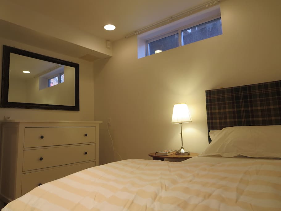 The bedroom has a new single bed with a thick mattress and nice soft headboard. The window has curtains for privacy. There is a 3-drawer clothes chest. It's a cosy room.