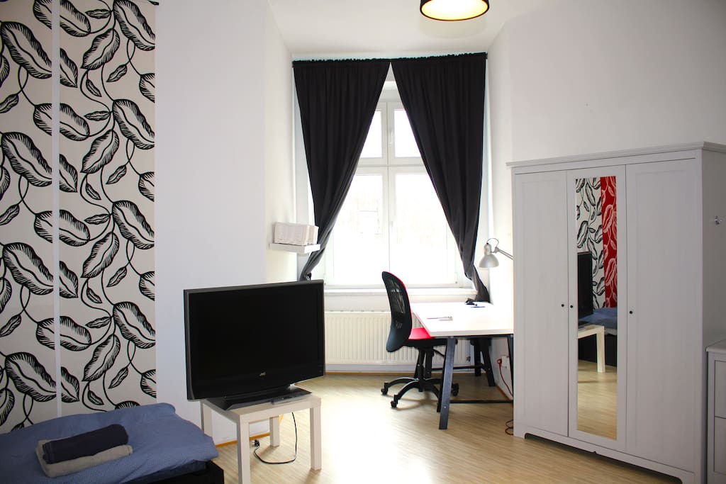 Working area with green view. Quick WiFi in the whole flat.
