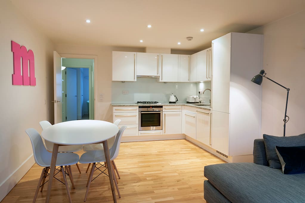 Kitchen includes a dishwasher and large fridge