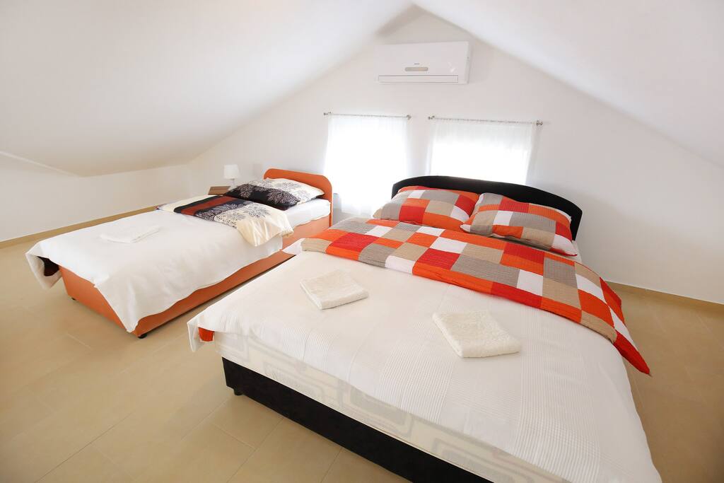 Bedroom with Double Bed and Two Single Beds
