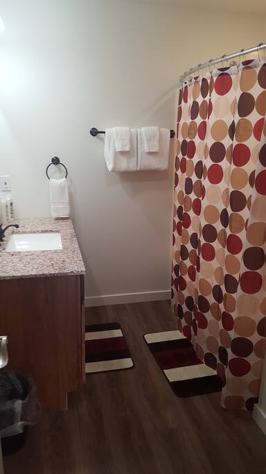 Private full bath with hair dryer and shower amenities