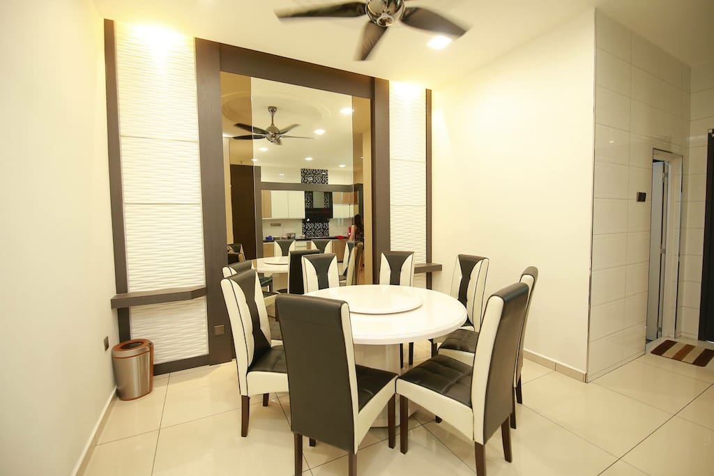 Classy dining area, a luxurious marble table and a cheerful night full of laughter.