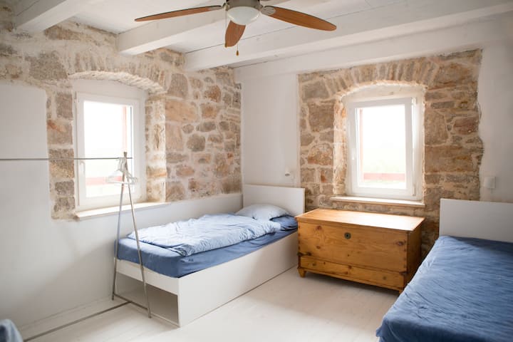 Second Floor: This is one of two bedrooms on the second floor. We designed the beds and the rack.