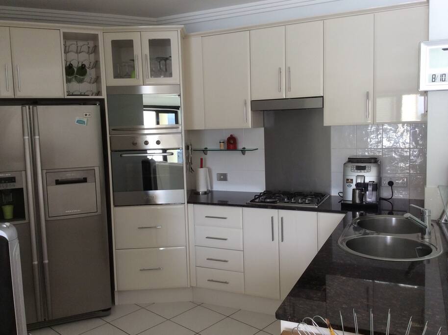 The well appointed kitchen has all amenities, including dishwasher, microwave, all cutlery and crockery and ice at the push of a button.