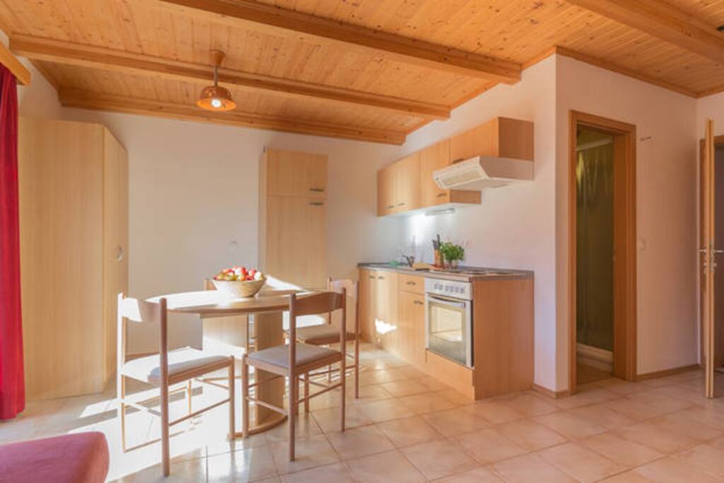 Kitchen and living room with exit to the balcony