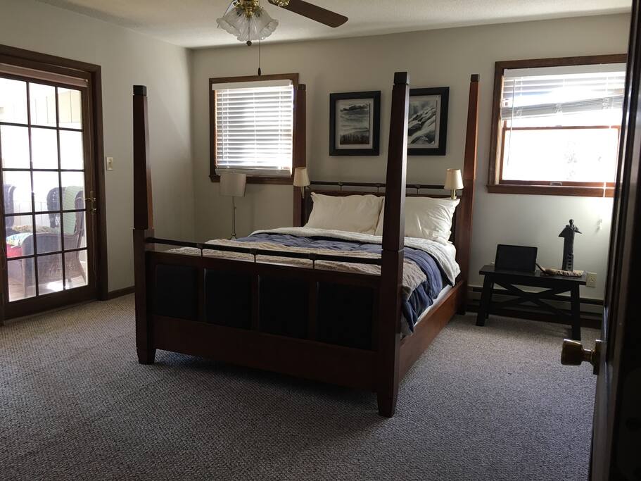 Master bedroom has a luxurious queen bed, an em suit bathroom, glass doors leading to the sunroom and of course a tv. Master bedroom is also equipped with a queen sized air mattress.