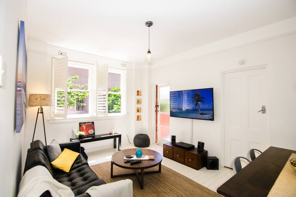 Awesome living area with access to balcony, also pictured. Cable TV and large flatscreen