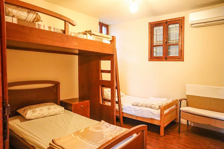 The middle room has 3 beds