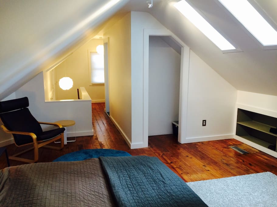 Light and airy upstairs master bedroom suite features a pillowtop king bed from which you can see the stars through skylights.