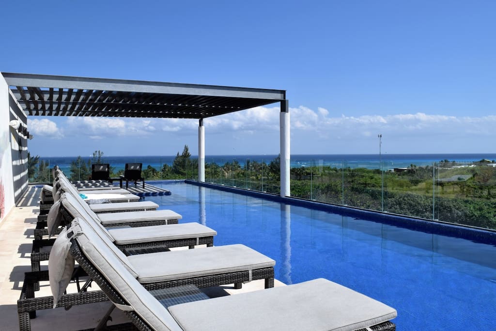 rooftop swimming pool, large enough for swimming laps, beautiful sea view & plenty of lounge chairs