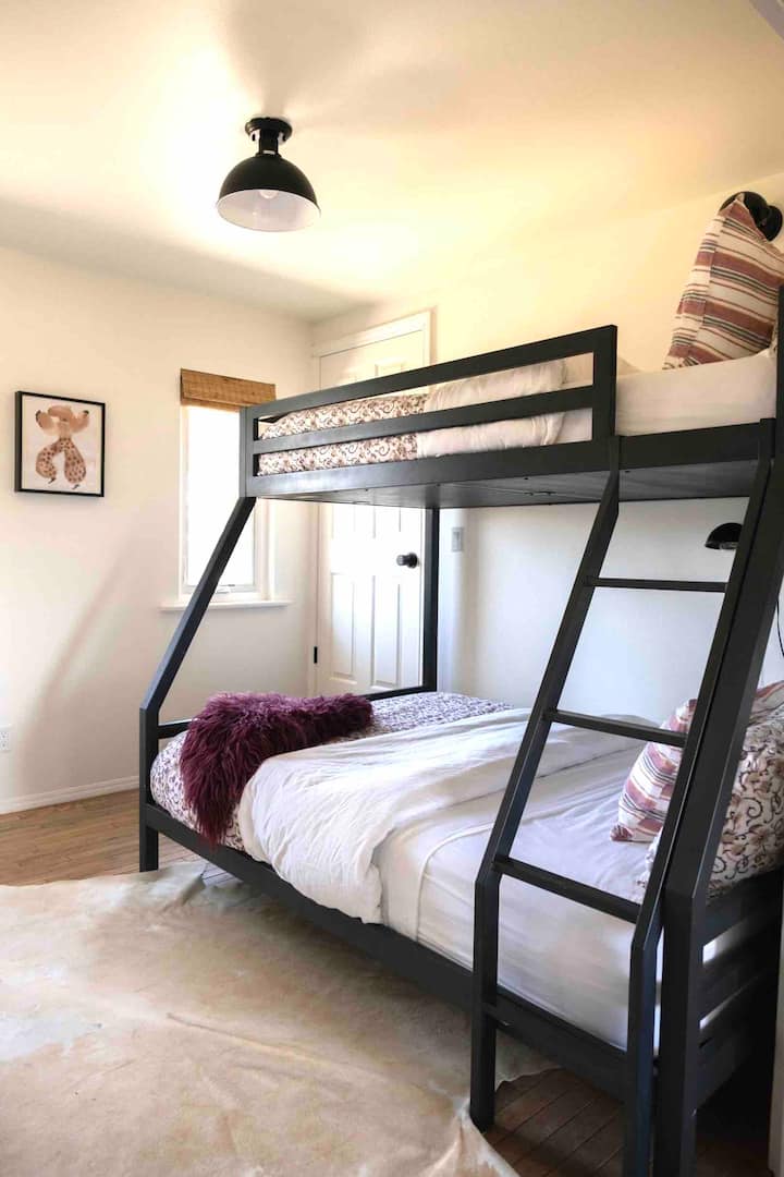 Our bunk room is outfitted with a full size mattress on the bottom, and a twin on top. Both beds have cozy organic sheets 