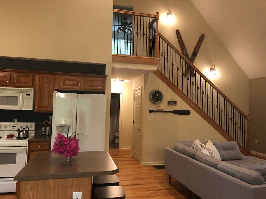 Main level of the home with stairs leading up to the private and luxurious master bedroom.