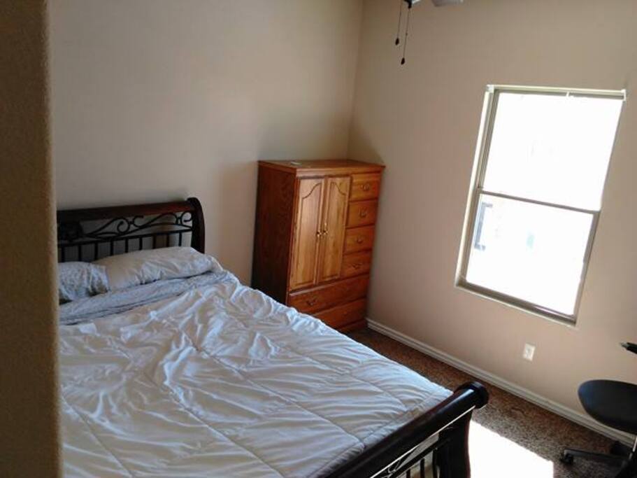The extra bedroom has a nice view, ceiling fan, and closet.