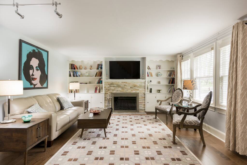 With hardwood floors throughout, new leather and custom furniture, decorative fireplace...perfect for entertaining.