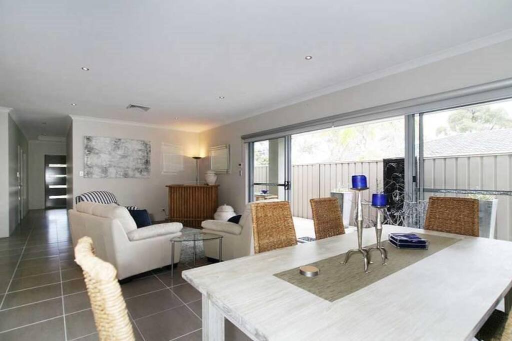 Open plan dining and combined sitting area overlooking water wall