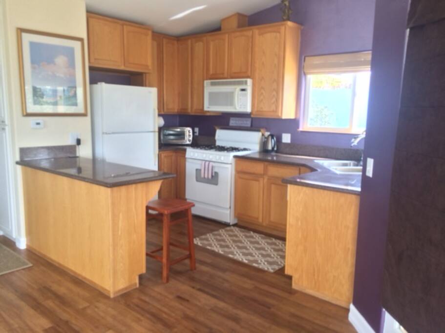 Modern kitchen with ocean view dining.