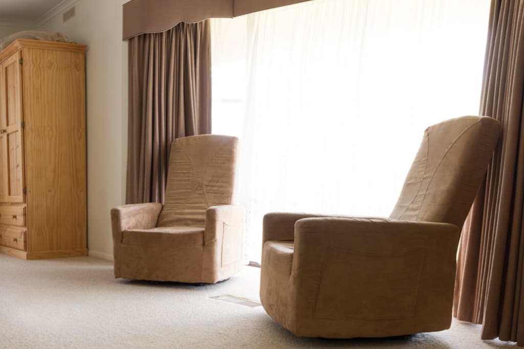 2 comfortable lounge chairs and wardrobe