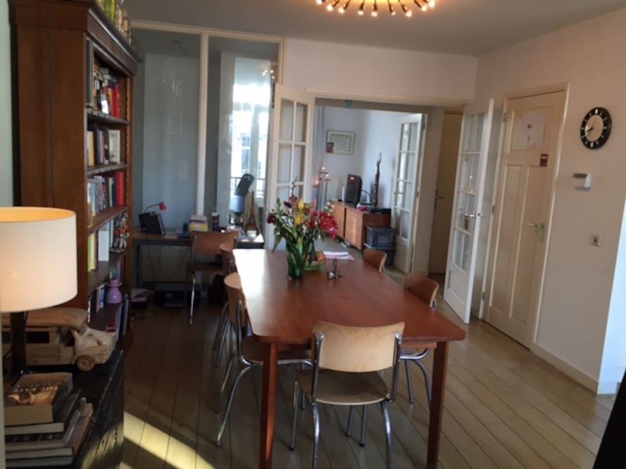 Same floor, further back (open kitchen to the right).