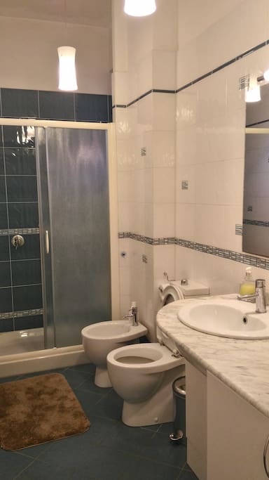 Bathroom with big shower and washing machine