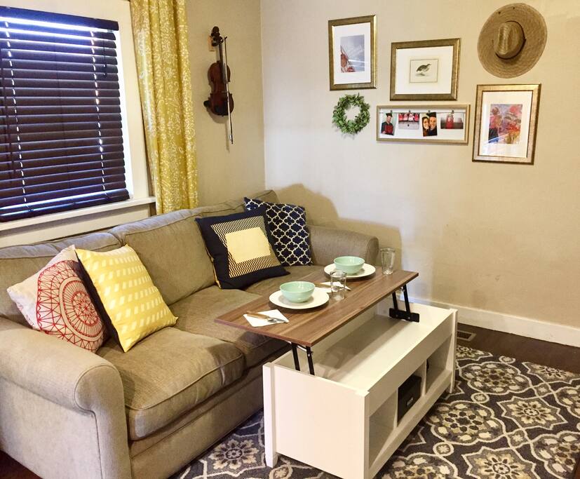 Large comfy couch that has a pullout Queen bed! Coffee table raises up to enjoy delicious food & watch your favorite shows, movies, & cuddle your sweetheart!