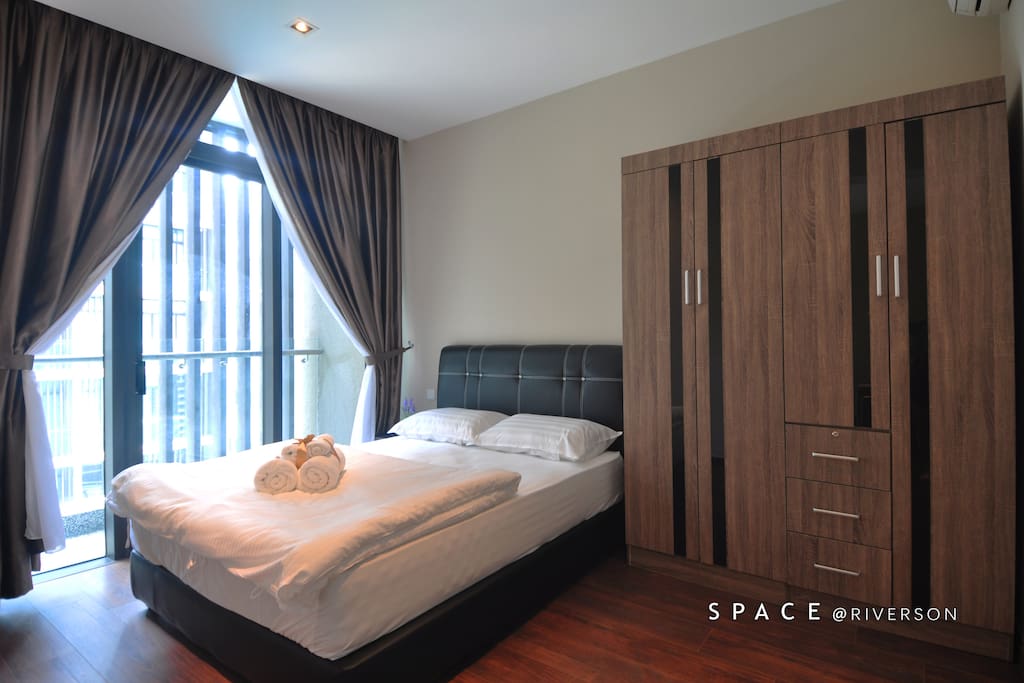 Queen bed room with ample wardrobe space. Balcony with swimming pool view.