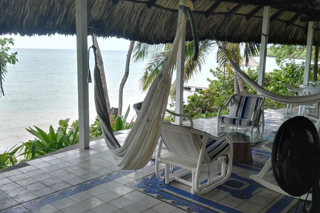 House terrace infront of the sea, very comfortable, with a magic view and surrounded by nature.