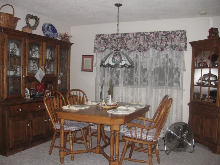 Dining room opens into living room and kitchen