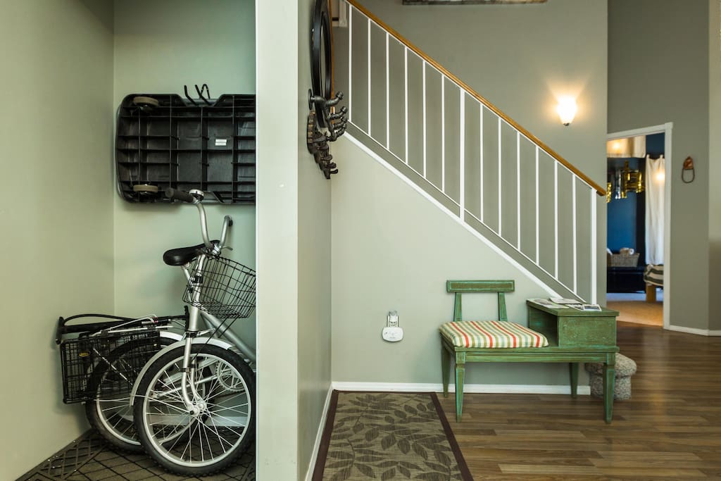 Front entry way. Luggage cart is above the folding bike.