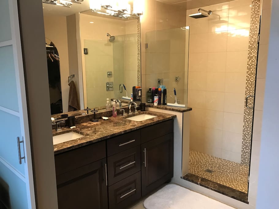 Attached private washroom and shower area comes with this room for guests