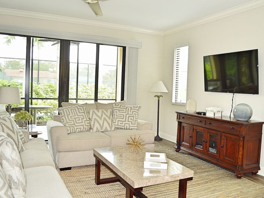 Tastefully decorated and comfortably appointed living room with ample guest seating and open floor plan