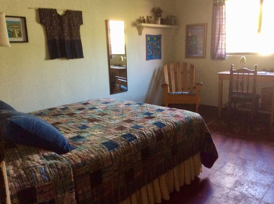 Room with queen bed and rocker