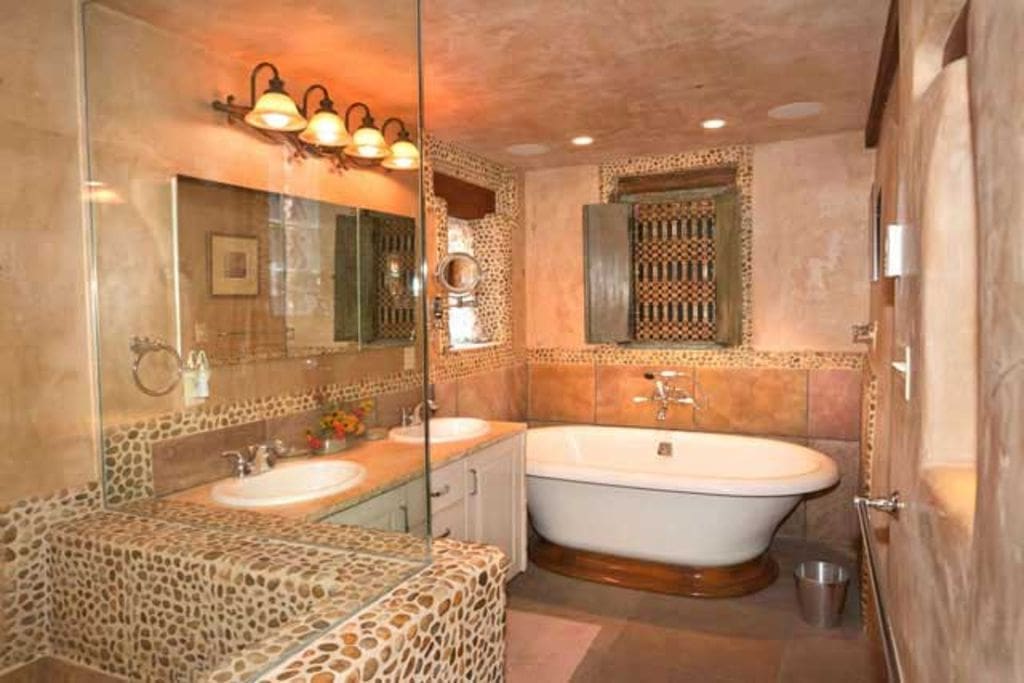 The master bathroom has two sinks and a steam shower.