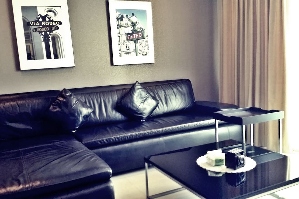 Living room, with big leather sofa, table