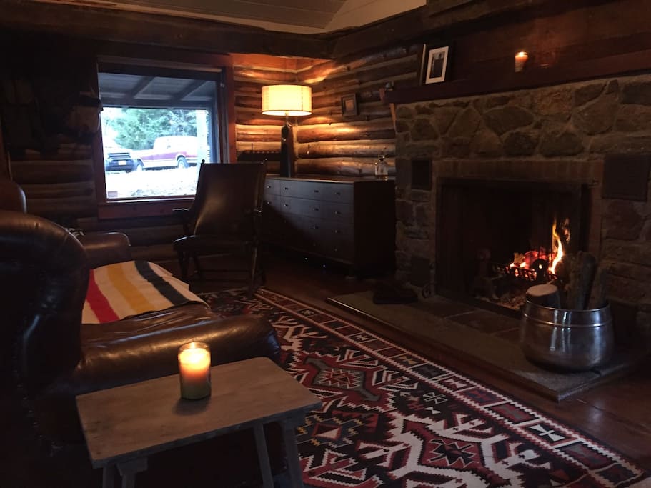 Living room with Original Stone Fireplace.