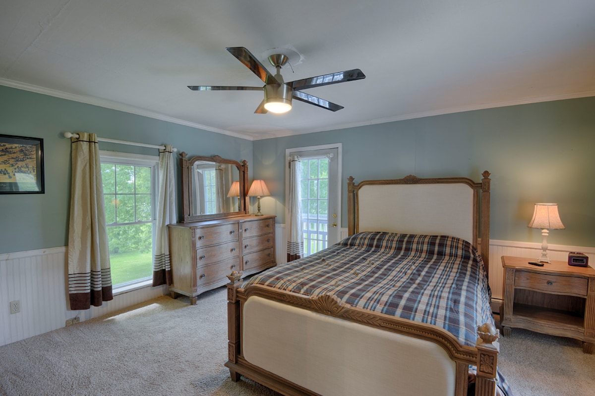 Bedroom 1 in rear of house w/ queen bed